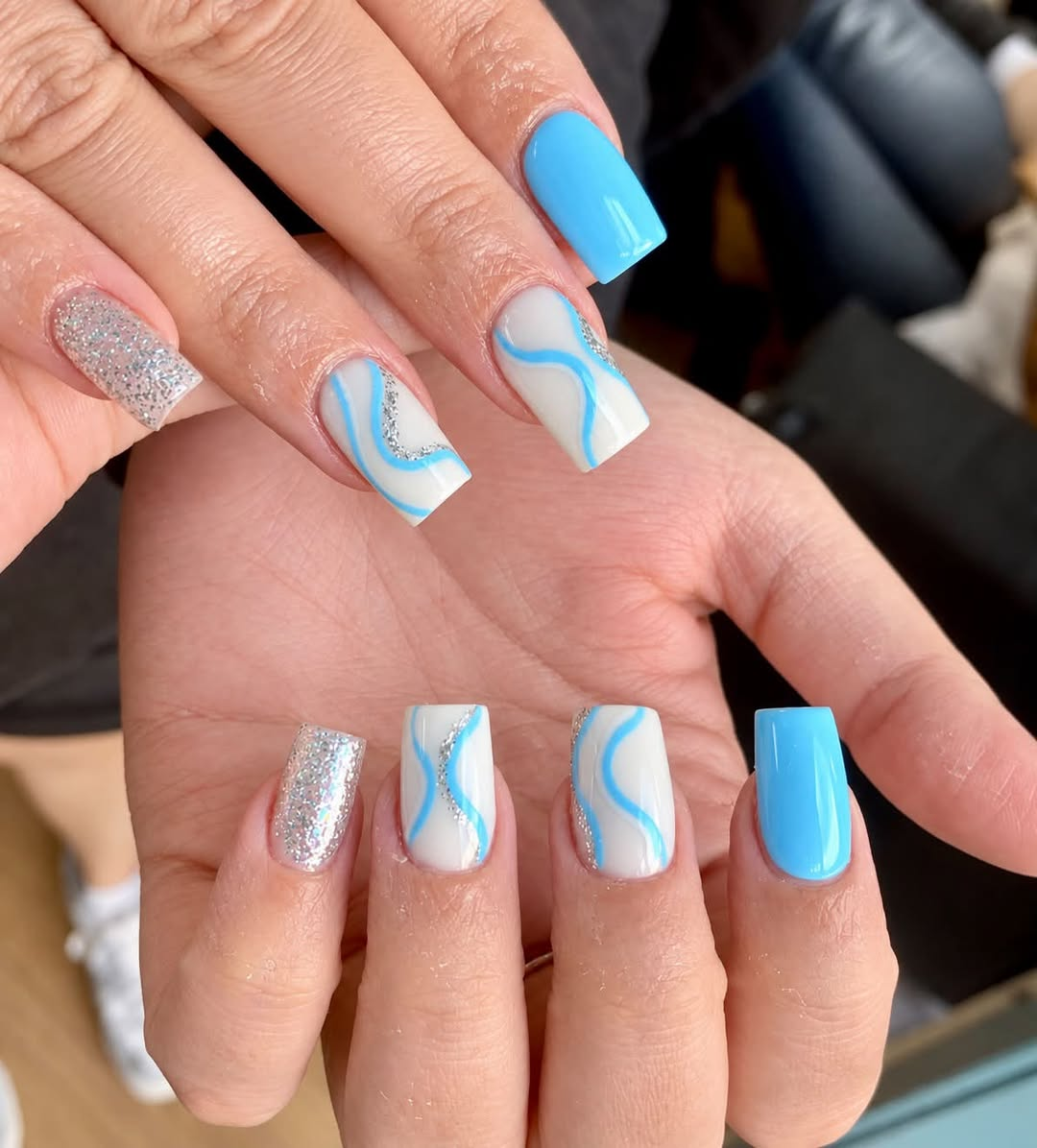 Blue and silver hand-painted nail art